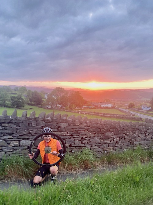 Piper with my punctured rear wheel at sunrise on All Points North 2023