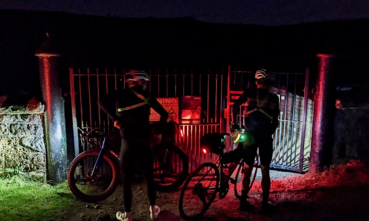 All Points North 2023 riders at Widdop Moor in the dark