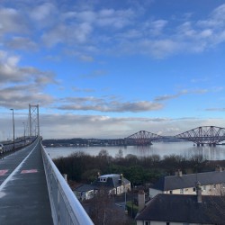 View northwards of the Forth road and rail bridges from the road bridge in the crisp morning sun