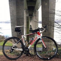 Giant road bike under the Tay Road Bridge
